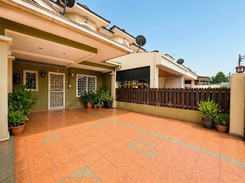 Exterior type: semi-detached house; features: tiled driveway, green painted walls, white metal gate, wooden fence, potted plants, satellite dishes on roof, manicured landscaping, terracotta roof tiles; style: modern.