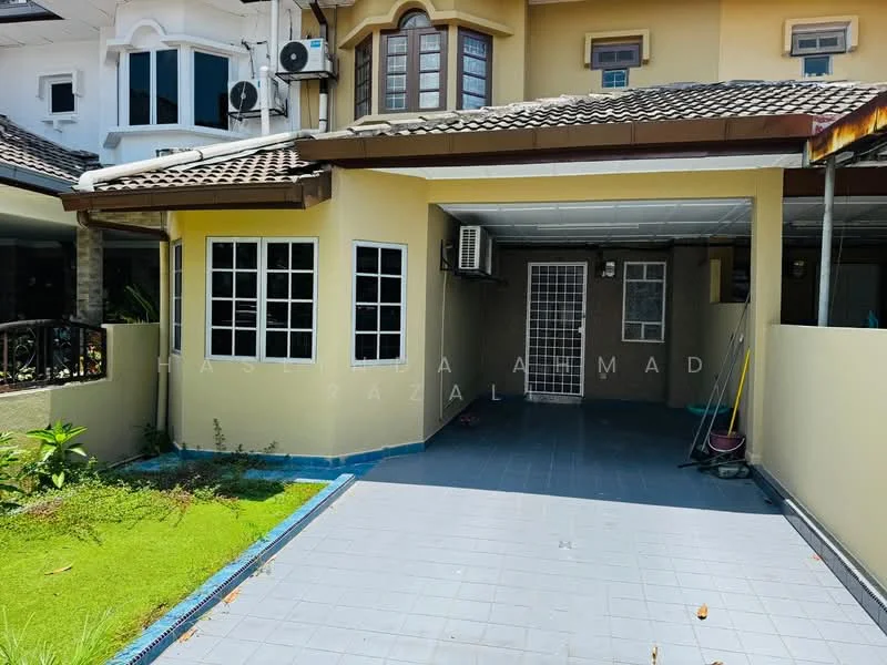 Exterior type: semi-detached house; features: yellow painted facade, flat roof with tiles, single-storey, manicured lawn, paved driveway, multiple windows, air conditioning unit visible, covered porch, garden area with grass, side access to garden; style: modern.
