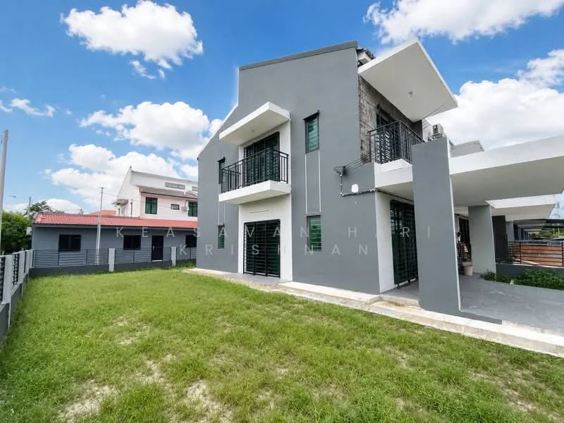 Exterior type: detached bungalow; features: grey painted facade, stone cladding, flat roof, two-storey building, manicured lawn, balconies with black railings, large windows, paved walkway, surrounded by greenery; style: modern.