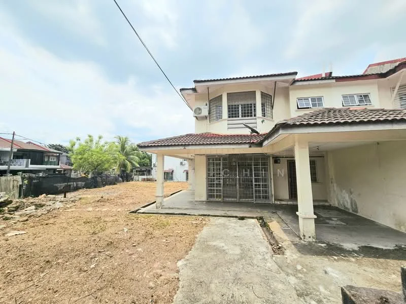 Exterior type: detached bungalow; features: two-storey building, red tiled roof, white painted facade, covered porch, large windows, gravel yard, surrounding greenery, exposed concrete flooring, air conditioning unit visible, fenced perimeter; style: modern.