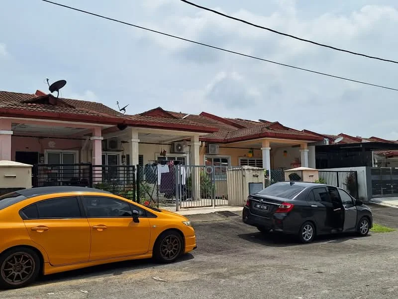 Exterior type: linked terrace house; features: red tiled roof, cream painted facade, front porch with gate, visible air conditioning units, laundry hanging in front yard, two parked cars, paved driveway, fenced yard; style: modern.