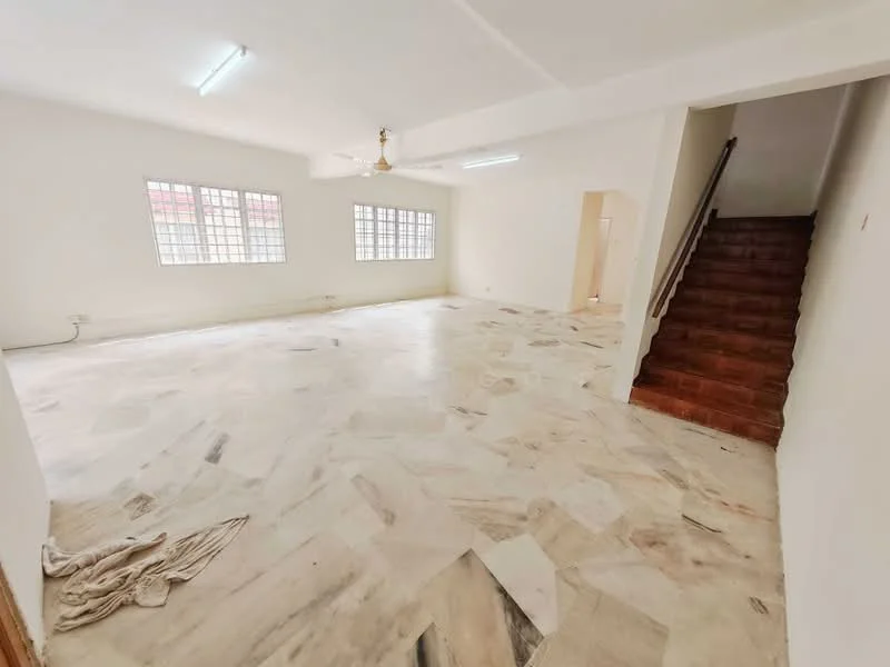 Living features: marble flooring, white painted walls, ceiling fan, large windows, staircase leading to upper floor, natural light, open layout, no visible furniture.