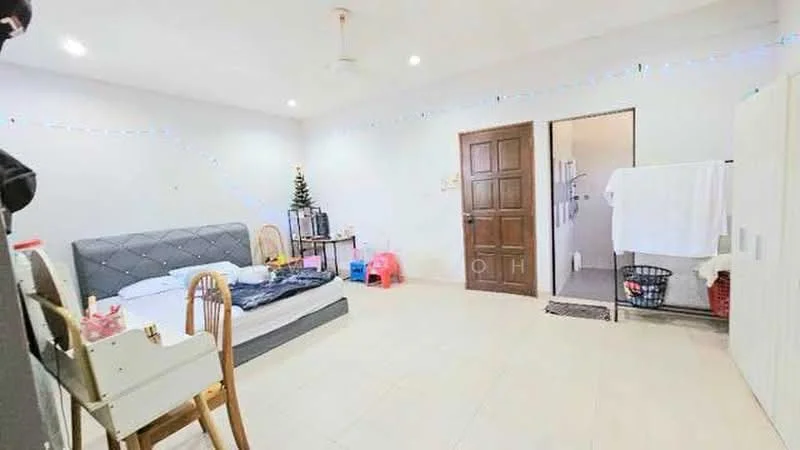 Bedroom features: queen-size bed with grey upholstered headboard, wooden chair, white walls, tile flooring, ceiling fan, built-in wardrobe, decorative Christmas tree, door leading to bathroom, laundry basket, white towels hanging, small pink table; style: modern.