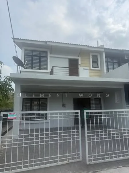 Exterior type: linked terrace house; features: white painted facade, cream accent wall, flat roof, two-storey structure, black framed windows, balcony with railing, gate at entrance, paved driveway, satellite dish, manicured landscaping; style: modern.