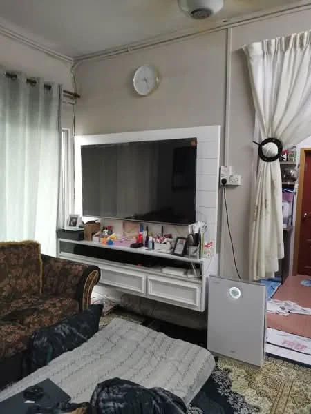 Living features: 3-seater fabric sofa in brown, wall-mounted TV, white TV console with drawers, decorative items on console, area rug with geometric pattern, curtains with sheer fabric, wall clock, air purifier, light fixture on ceiling, painted walls in light color, wooden door in background; style: contemporary.