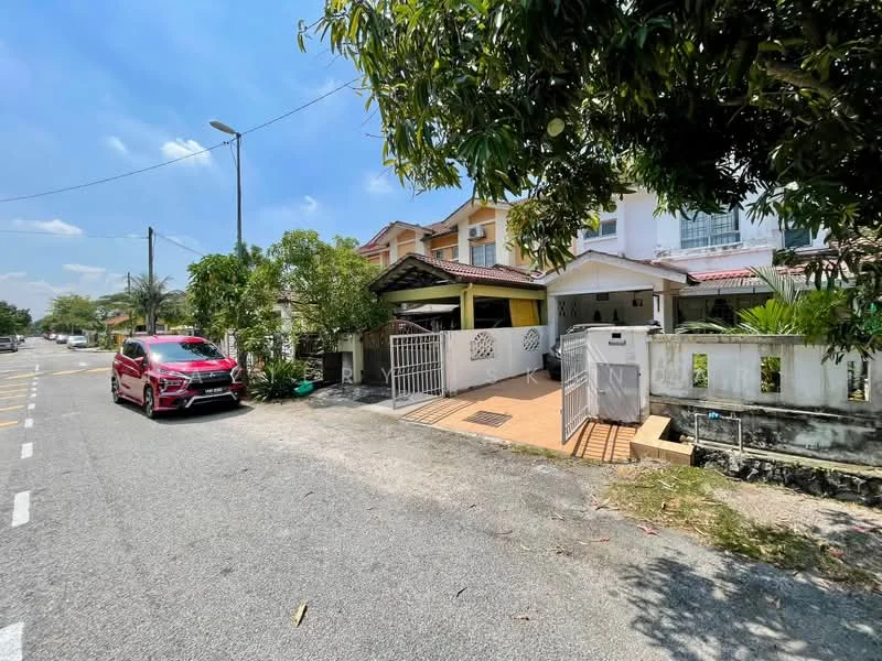 Exterior type: semi-detached house; features: white painted facade, red tiled roof, manicured lawn, paved driveway, car porch with awning, surrounded by greenery, front yard with low wall, street view, single-storey, adjacent to main road; style: modern.