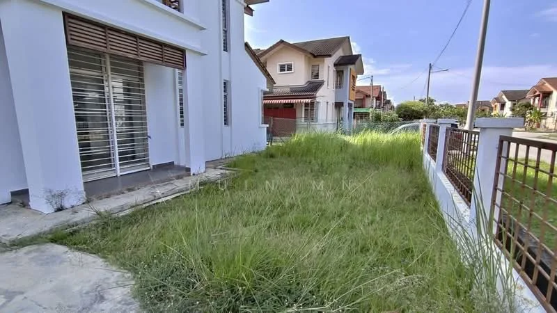 Exterior type: detached bungalow; features: white painted facade, single-storey, overgrown grass, concrete pathway, fenced perimeter, adjacent residential houses, clear blue sky; style: modern.