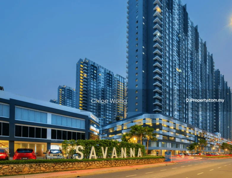 Exterior type: high-rise condominium; features: glass curtain wall, projecting balconies, multiple storeys, landscaped garden at base, signage with name 'SAVANNA', parking spaces visible, street view with traffic, urban context with surrounding buildings; style: modern.