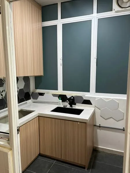 Kitchen features: single-bowl black sink, chrome pull-down faucet, white countertop, wood cabinetry with vertical grain, hexagonal tile backsplash, grey tile cladding, black tile flooring, floor-to-ceiling windows; style: modern.