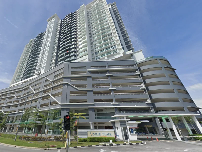 Exterior type: high-rise condominium; features: glass curtain wall, grey painted facade, multiple balconies, parking deck, landscaped entrance, surrounded by greenery, modern architectural design, street view, signage at entrance; style: modern.