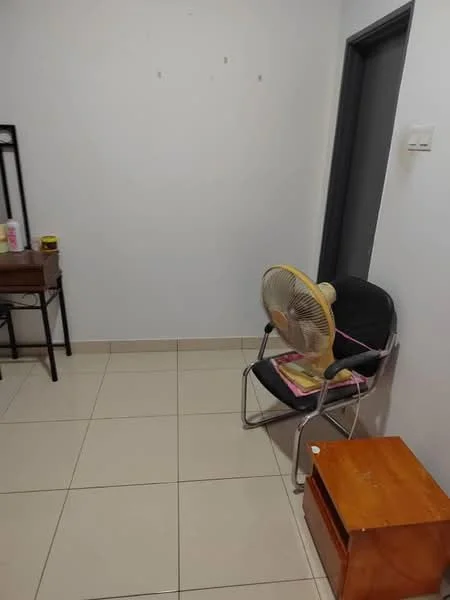 Room features: white painted walls, ceramic tile flooring, single chair, table, standing fan, wooden storage box, doorway, minimal decor; style: minimalist.