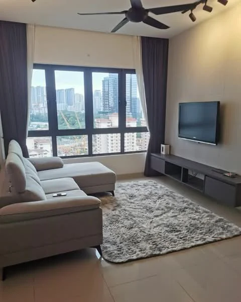Living features: L-shape sectional sofa in grey, coffee table, wall-mounted TV, TV console in dark wood, area rug with fluffy texture, floor-to-ceiling windows, sheer curtains, blackout curtains, ceiling fan, decorative wall, city skyline view; style: modern; view: city.