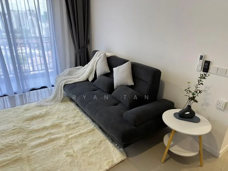 Living features: 3-seater fabric sofa in grey, 2 decorative cushions, round side table with white top and wooden legs, area rug in cream, floor-to-ceiling windows with sheer curtains, wall-mounted intercom panel, decorative plant in ceramic pot, smooth tiled flooring; style: modern; view: city.