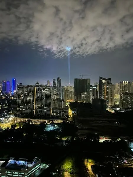 Exterior type: high-rise condominium; features: city skyline view, nighttime lighting, tall buildings, urban landscape, cloudy sky, beams of light in the sky; style: modern.