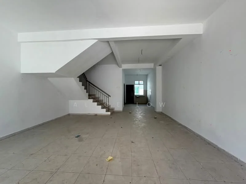 Room features: white painted walls, tile flooring, staircase with wooden handrail, large window for natural light, open layout, high ceiling, no visible furniture or decor, empty space; style: minimalist.