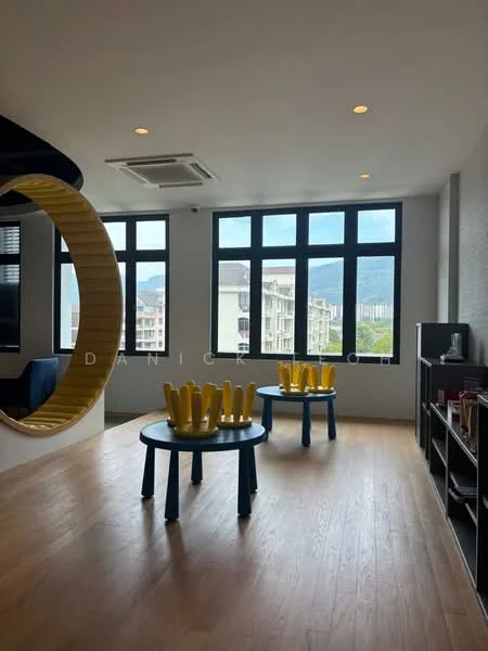 Room features: large windows with mountain view, wooden flooring, ceiling-mounted air conditioning unit, blue circular seating area, two round tables with yellow decorative items, light-colored walls, open layout; style: modern; view: mountain.