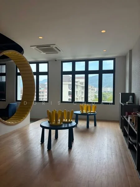 Room features: large windows with black frames, wooden flooring, ceiling lights, decorative circular seating area, two round tables with blue legs, yellow decorative items on tables, exposed brick wall, mountain view visible through windows; style: modern; view: mountain.