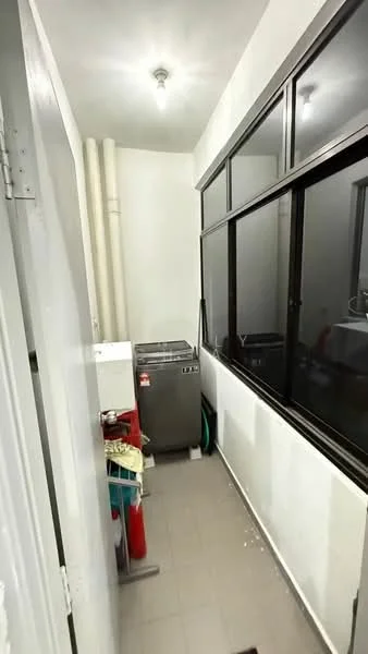 Laundry features: washing machine, grey tiled flooring, white painted walls, large windows, exposed pipes, light fixture, cleaning supplies, hose, utility sink.