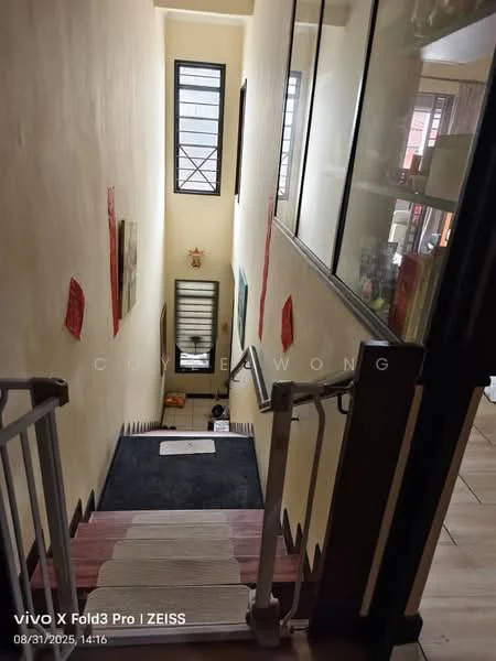 Room features: staircase with wooden steps, metal railing, cream painted walls, decorative wall art, windows with black frames, carpet runner on stairs, laminate flooring at bottom, light source from windows; style: modern.