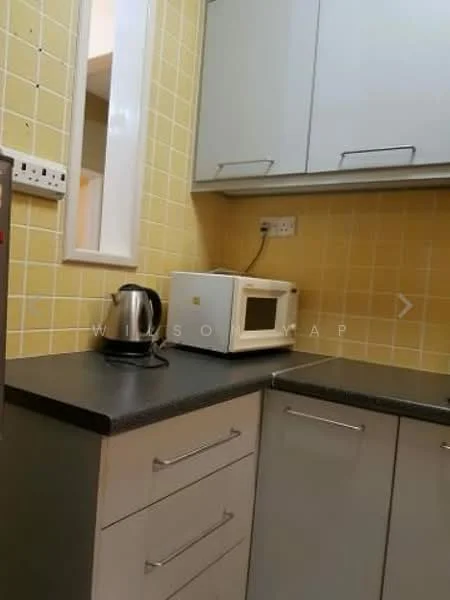 Kitchen features: yellow tiled walls, grey countertop, white cabinetry, stainless-steel kettle, white microwave, built-in cabinets, refrigerator, single-bowl stainless-steel sink, chrome faucet; style: modern.