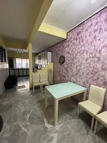 Dining features: light purple textured accent wall, cream painted walls, grey marble tile flooring, glass dining table, 4 white upholstered dining chairs, wall-mounted dartboard, recessed ceiling lights, open layout to kitchen; style: modern. Kitchen features: white cabinetry, black countertop, kitchen appliances visible, window for natural light.