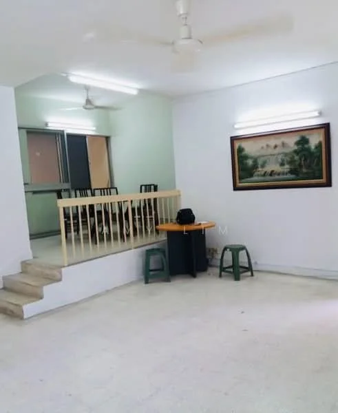 Room features: white painted walls, ceiling with fluorescent lights, light-colored tiled flooring, wooden railing, staircase, dining table with chairs, green plastic stools, wall-mounted artwork; style: minimalist.