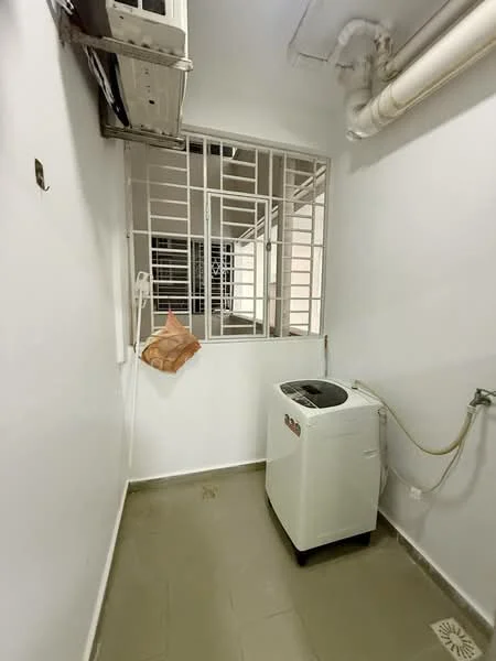 Laundry features: washing machine, white walls, grey tiled flooring, window with security bars, air conditioning unit, plumbing connection, drainage floor grate.