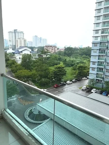 Room features: glass railing, concrete flooring, balcony view of greenery, city skyline in background, overcast sky; style: modern; view: garden.