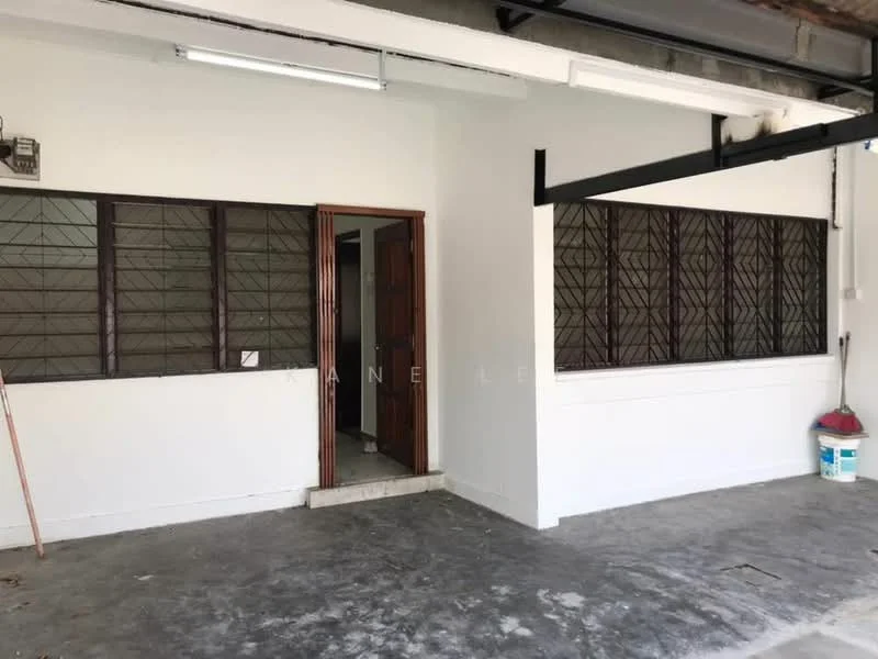 Room features: white painted walls, concrete flooring, wooden door, large windows with metal grilles, exposed ceiling, light fixture, entrance area, no visible furniture; style: minimalist.