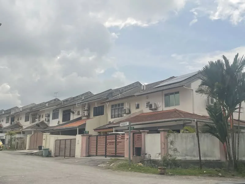 Exterior type: linked terrace house; features: two-storey linked terrace, white painted facade, red tiled roof, solar panels on roof, front porch with gate, manicured lawn, paved driveway, multiple air conditioning units visible, surrounded by palm trees, street sign visible, cloudy sky; style: modern.