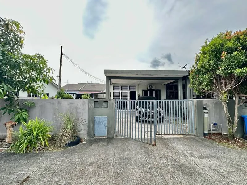 Exterior type: detached bungalow; features: grey concrete facade, flat roof, single-storey, manicured lawn, mature trees, paved driveway, metal gate, fenced perimeter, outdoor lighting, satellite dish, car parked in driveway; style: modern.