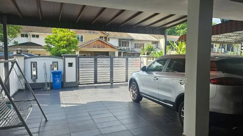 Exterior type: linked terrace house; features: paved driveway, covered car porch, metal gate, fence, blue recycling bin, surrounding greenery, adjacent residential buildings, sliding gate; style: modern.