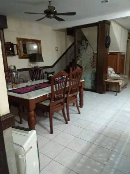 Dining features: wooden dining table, 4 wooden dining chairs, ceiling fan with light, wall-mounted mirror, decorative wall art, tiled flooring, staircase leading to upper floor, wall paneling, sofa with cushions, side table, light fixture, open layout to living area; style: traditional.