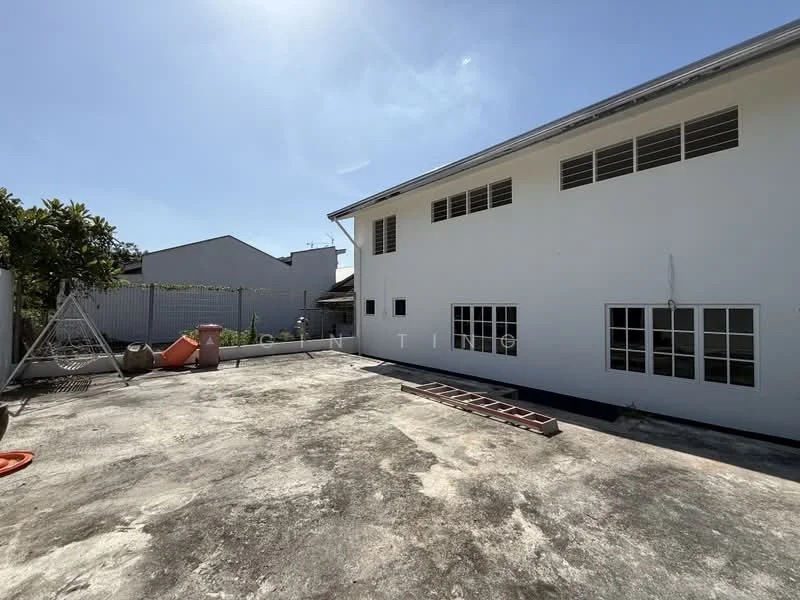 Exterior features: white painted facade, flat roof, concrete flooring, multiple windows, surrounded by greenery, open outdoor space, fenced perimeter; style: modern.