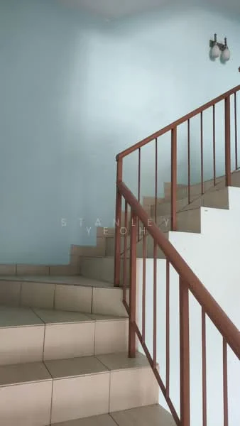 Room features: light blue painted walls, staircase with wooden railing, ceramic tile flooring, steps leading upwards, wall-mounted light fixtures.