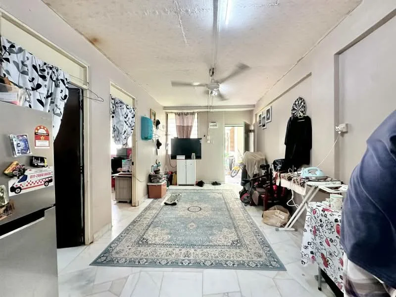 Living features: marble tile flooring, white painted walls, ceiling fan, area rug with intricate pattern, sofa, TV console, wall-mounted TV, decorative wall clock, open shelving, dining table, windows with sheer curtains.