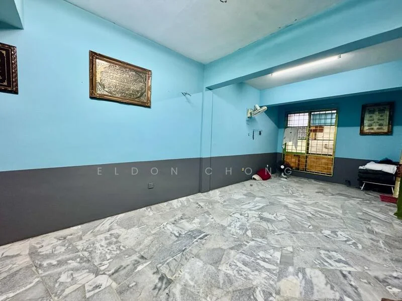 Room features: blue painted walls, grey painted lower wall, marble flooring, window with security bars, air conditioning unit, decorative wall frames, door leading outside.