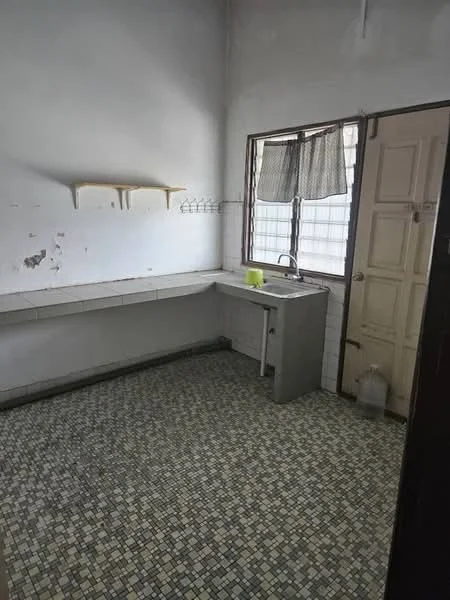 Kitchen features: single-bowl stainless-steel sink, chrome faucet, white tiled backsplash, grey countertop, open shelving above sink, mosaic tile flooring, window with sheer curtains, wooden door, wall-mounted coat rack.