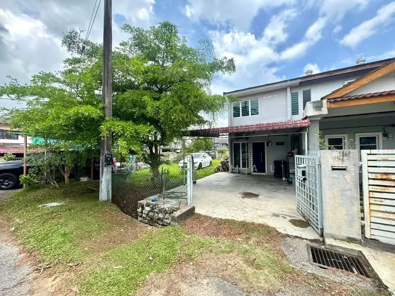 Exterior type: semi-detached house; features: two-storey structure, red tiled roof, white painted facade, front porch area, manicured lawn, mature trees, driveway with concrete surface, fenced perimeter, visible parking area, adjacent to road; style: modern.