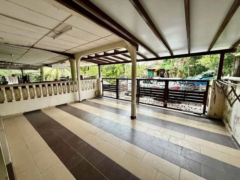 Room features: wooden ceiling beams, white ceiling, tile flooring in beige and dark brown, open layout, balcony railing, large windows, outdoor view, exposed concrete walls, natural light; style: traditional; view: garden.