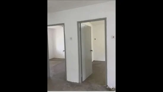 Room features: white painted walls, concrete flooring, two doorways, no visible windows, plain ceiling; style: minimalist.