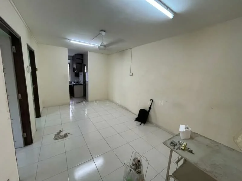 Room features: white painted walls, white tiled flooring, ceiling fan, fluorescent ceiling lights, open layout, doorway leading to kitchen, empty space, wall-mounted electrical outlets.