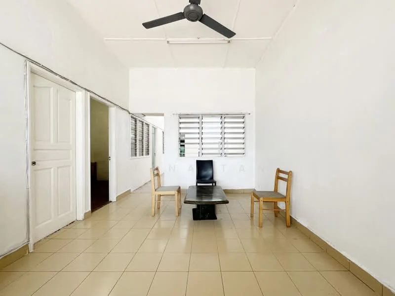 Living features: white painted walls, tile flooring, ceiling fan, two wooden chairs, black coffee table, window with horizontal slats, doorway to adjacent rooms; style: minimalist.