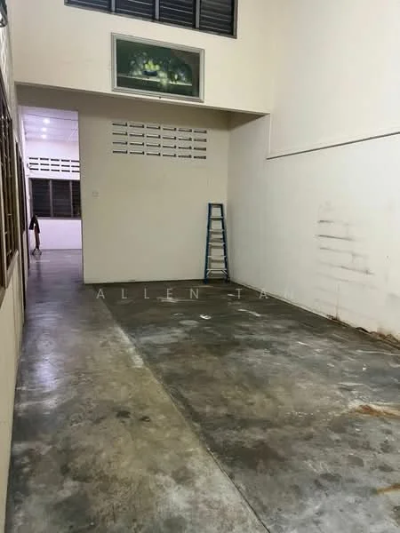Room features: concrete flooring, white painted walls, large windows, ladder, exposed ceiling, no visible furniture, minimal decor, unfinished appearance.