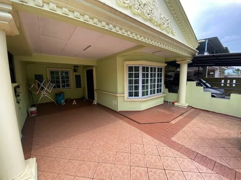 Exterior type: detached bungalow; features: covered porch, terracotta tile flooring, green painted walls, large bay windows, decorative cornice, columns at entrance, manicured landscaping, car porch, driveway, outdoor lighting; style: traditional.