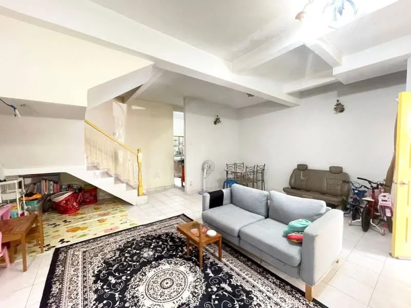Living features: grey fabric sofa, wooden coffee table, area rug with geometric pattern, white painted walls, exposed beams on ceiling, tile flooring, ceiling fan, decorative wall lights, bookshelf, children's play area with colorful mat, bicycle, two-seater sofa, wall-mounted decor; style: modern. Room features: staircase with yellow railing, open layout, light-colored walls.