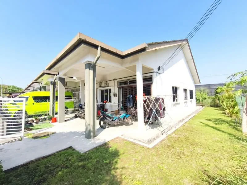 Exterior type: detached bungalow; features: white painted facade, flat roof, single-storey, manicured lawn, paved walkway, car porch, garden area, multiple windows, visible vehicles, fenced perimeter; style: modern.
