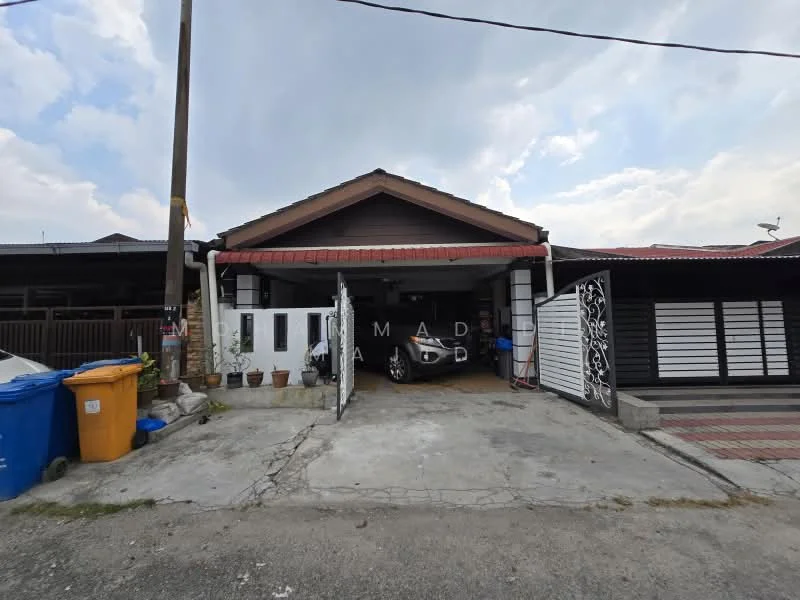 Exterior type: semi-detached house; features: single-storey, red tiled roof, white painted facade, car porch with awning, manicured lawn, paved walkway, gated entrance, visible driveway, surrounded by residential area; style: traditional.