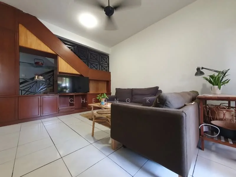 Living features: brown fabric sofa, wooden coffee table, TV console with built-in storage, wall-mounted TV, ceiling fan, white painted walls, tile flooring, decorative plant in ceramic pot, wooden side table with lamp, wood panel accent wall; style: modern.