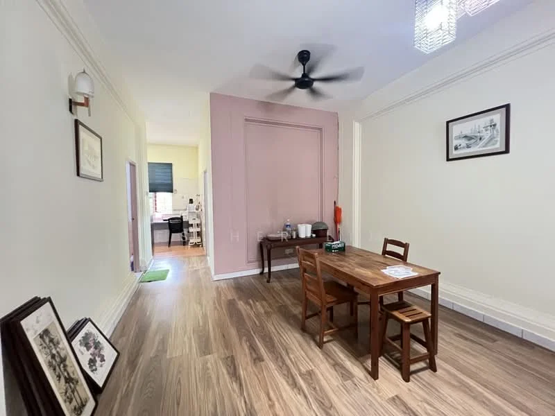Dining features: wooden dining table, 4 wooden chairs, 5-blade ceiling fan with light, light-colored painted walls, pink accent wall, laminate flooring, framed artwork on wall, decorative wall sconce; style: modern. Room features: doorway leading to kitchen, doorway leading to hallway, light-colored painted walls, laminate flooring.